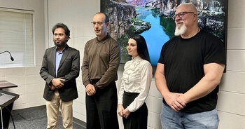 Rasha Alshawi with her doctoral committee at her dissertation defense.